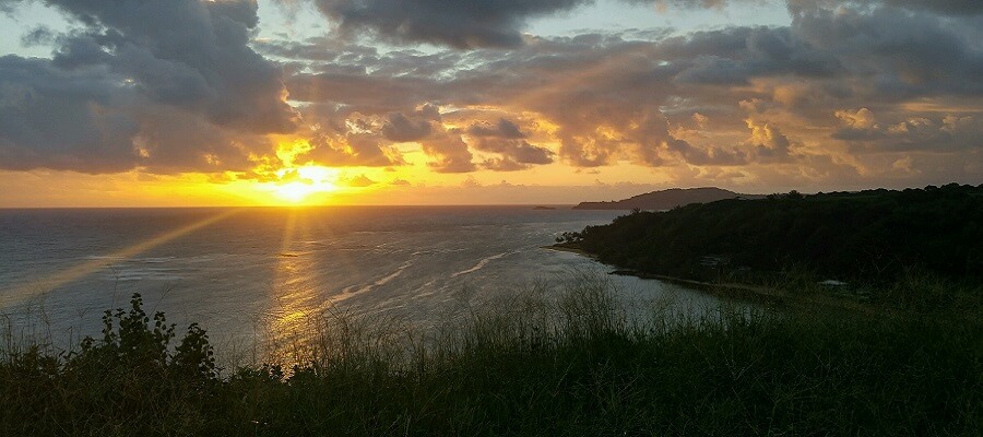 The sun sets over the Pacific in Kauai.